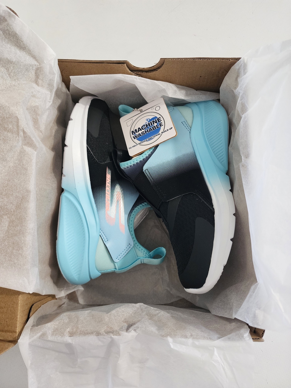 Skechers Kids Slip-On Sneakers in Black and Light Blue